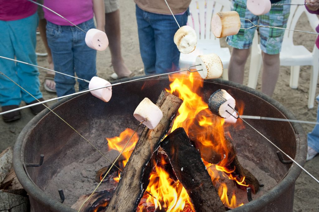Roasting marshmallows on fireplace