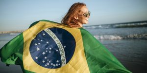 girl with Brazil flag on beach