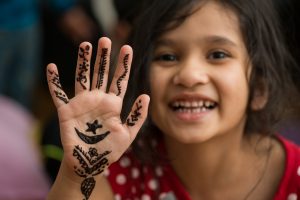 girl with henna design on her hands